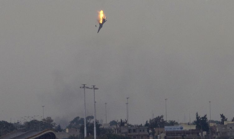 A warplane of Moammar Gadhafi's forces is shot down over the outskirts of Benghazi, Libya, in March 2011.