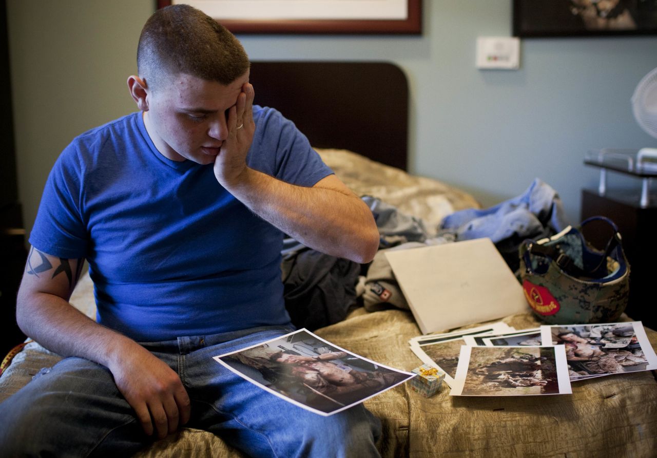 Cpl. Burness Britt, the U.S. Marine from an earlier photo in this gallery, reacts in December 2011 after seeing pictures of his medical evacuation.