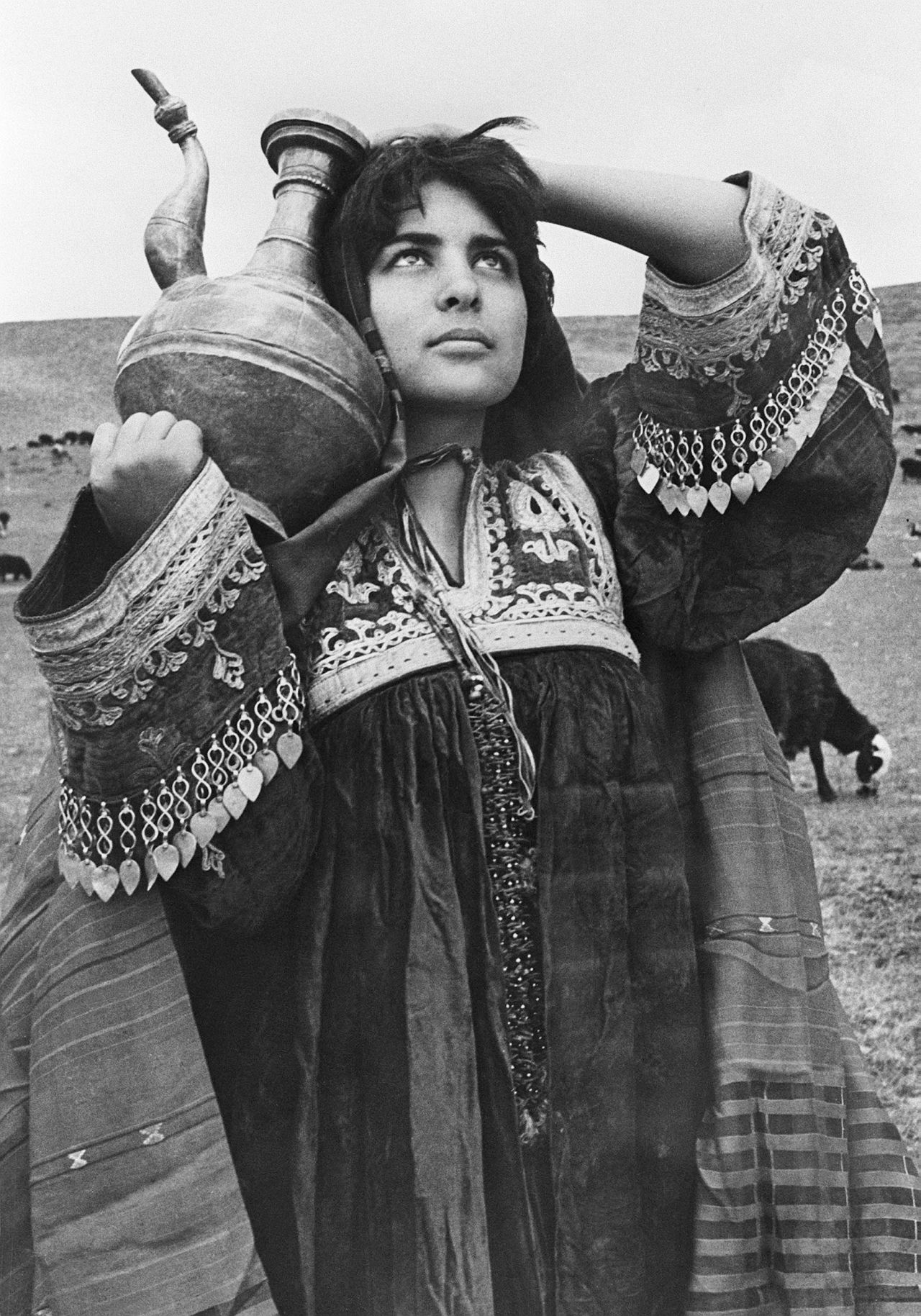 A nomad girl shows off her elaborate costume which is unique to women from the Afghan Pashtun ethnic group to which nomads also belong. The date when this photograph was taken is unknown.