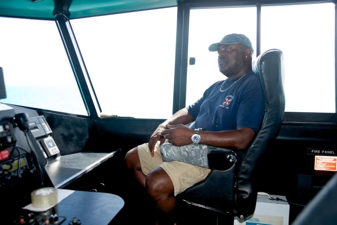 Captain Jed Munroe at the helm of "Island Link" heading to Long Island. "We carry everything and anything," says Munroe. 