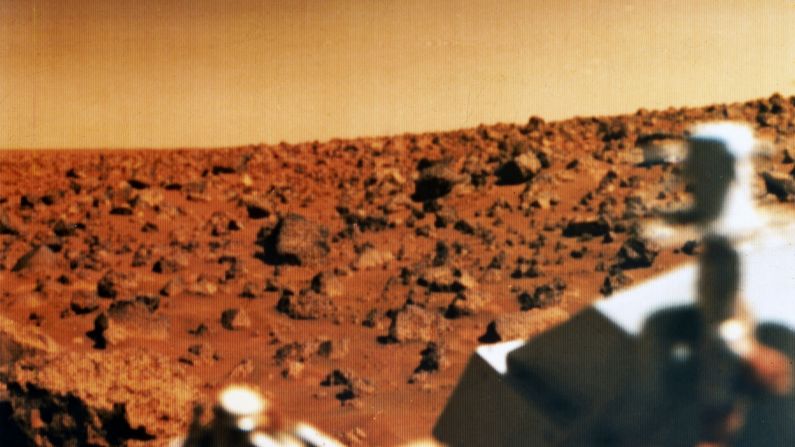 Don't we all wonder what's out there, especially when we launch spacecraft to another planet? Perhaps our greatest search is for whether we live alone in the cosmos. This photo shows the red Martian landscape and part of the Viking 2 lander, which was launched in September 1975 and landed in the Utopia Planitia region of Mars on September 3, 1976. It studied the Martian environment, soil constituents and searched for simple life forms. None were found.