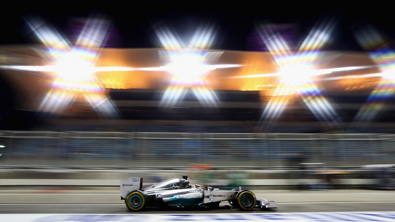 Lewis Hamilton continued his fast start to the 2014 F1 season finishing quickest under the lights in Friday's practice in Bahrain. 