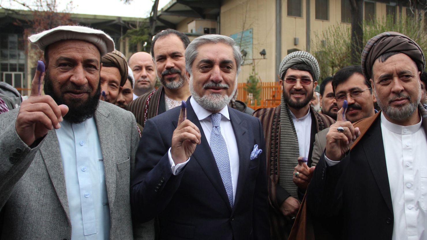 Presidential candidates Dr. Abdullah Abdullah, center, and his running mates cast their ballots in Kabul.