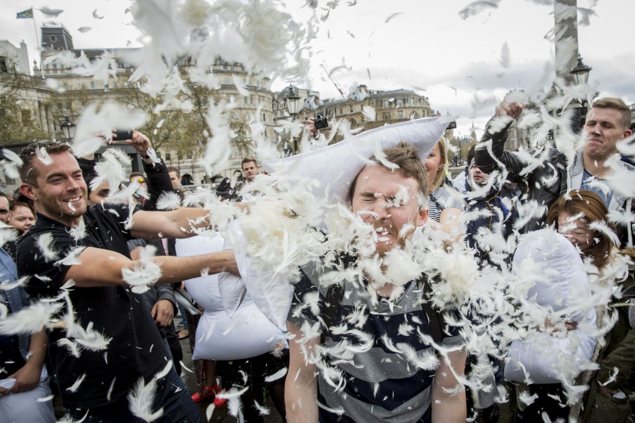 Revelers take part in a giant pillow fight on the north terrace of London's Trafalgar Square.