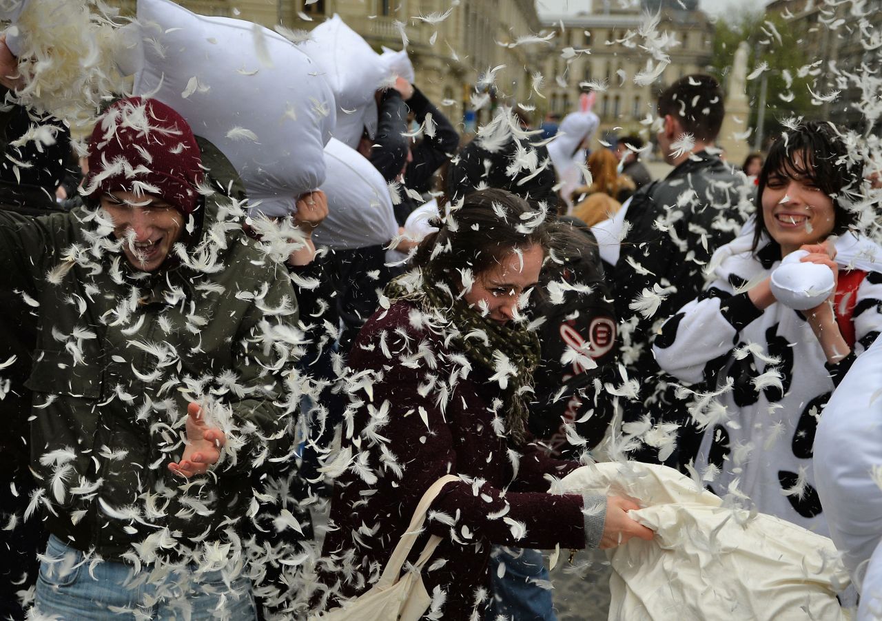 Pillows and feathers take flight as the fight takes place in Bucharest, Romania.