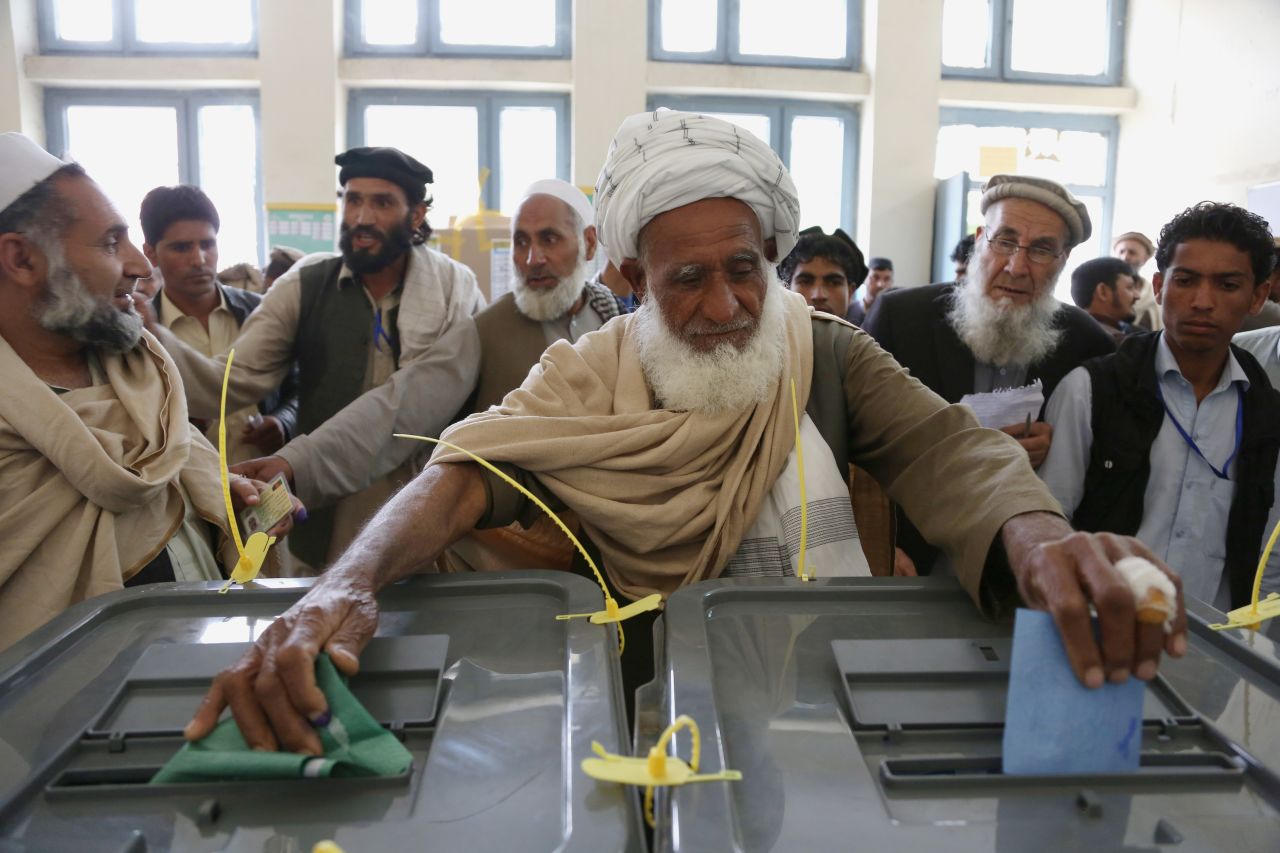 An Afghan man casts his vote at a polling station in Jalalabad on Saturday, April 5. A heavy security presence across the country ensured that the vote went largely smoothly, although some attacks were reported.