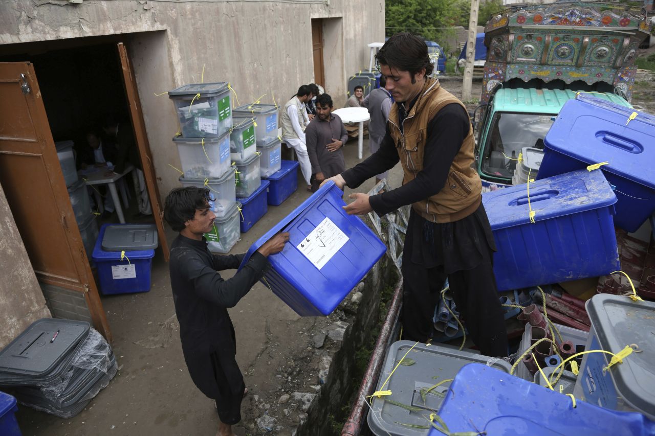 Workers at the Afghan Election Commission office unload ballot boxes from a truck on Sunday, April 6. Ballot boxes from Afghanistan's 34 provinces were being transferred to the capital, Kabul, after preliminary counts at the polling sites, an official said. Afghan voters turned out in large numbers Saturday for historic presidential and provincial elections.