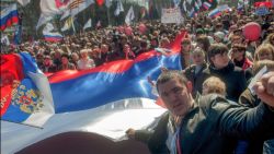 Pro-Russian protesters hold a giant Russian flag during their rally in downtown Donetsk, Ukraine, 06 April 2014. Protesters called for former President Yanukovych's return to Ukraine and to hold a referendum on the status of the Donetsk and Lugansk regions, similar to the recently held referendum in Crimea. 