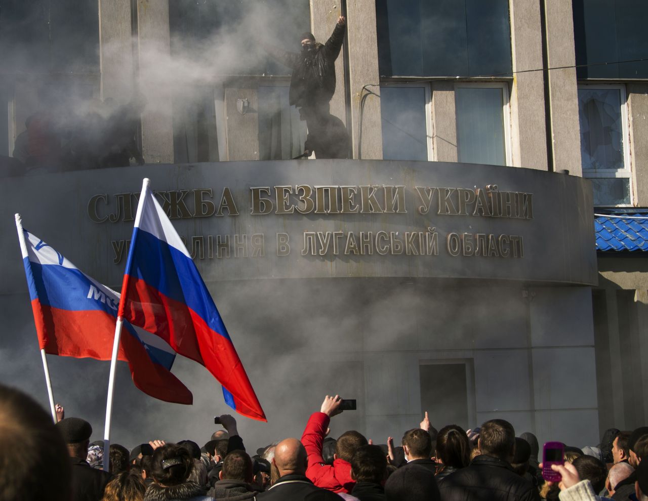 Pro-Russian activists hold a rally in front of a Ukrainian Security Service office in Luhansk on April 6. 