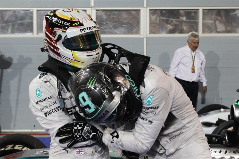 The two drivers, who have been friends and rivals since childhood, tussle playfully after Hamilton triumphs for the second race in a row on the 10th anniversary of Formula One arriving in the Middle East. 