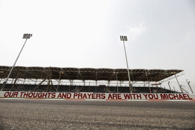 The Bahrain International Circuit also had a sign in honor of the seven-time world champion, who on the Friday before the race was said to be showing signs of awakening from the three-month coma he has been in after a skiing accident.