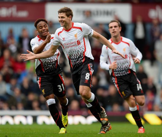 Liverpool captain Steven Gerrard celebrates after scoring the first of his two penalties in the 2-1 win at West Ham, which put his side back at the top of the English Premier League.