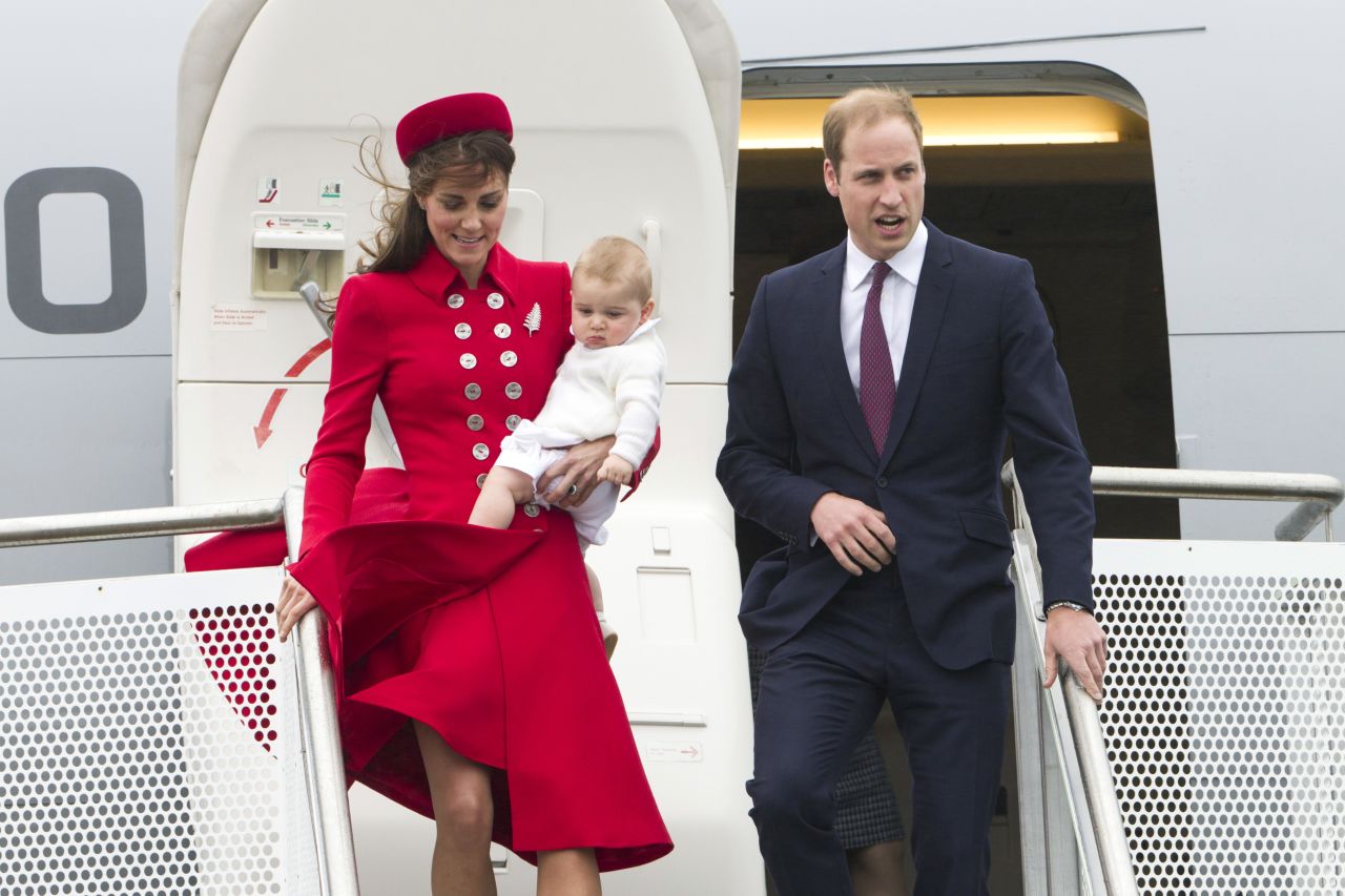 Britain's Prince William and Catherine, Duchess of Cambridge, with Prince George arrive at the International Airport in Wellington, New Zealand, on Monday, April 7. It was the couple's first visit to New Zealand. Take a look at other British royal children on trips: