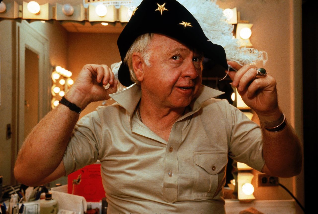Rooney tries on a feathered hat in his dressing room during a run of the play "Sugar Babies" in October 1979. He was nominated for a Tony for the role.  