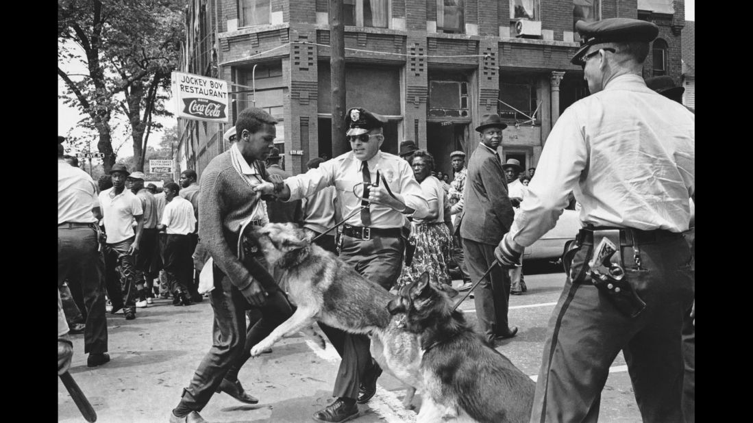 A police dog jumps at a 17-year-old civil rights demonstrator in Birmingham, Alabama, on May 3, 1963. The image appeared on the front page of The New York Times the next day.