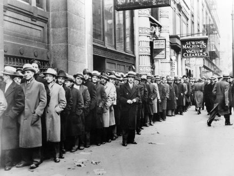 Thousands of unemployed people waited in line to register for federal relief jobs in New York in 1933. The unemployment rate rose to 25% that year.    