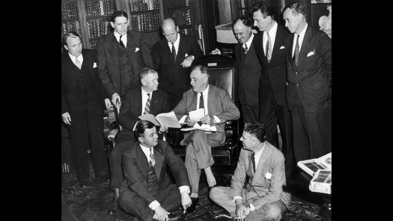 On September 12, 1935, Franklin D. Roosevelt and his staff met to find a solution to the economic crisis. FDR's New Deal policies tightened regulation of Wall Street, strengthened unions and set the top marginal tax rate for the rich at 90%.  