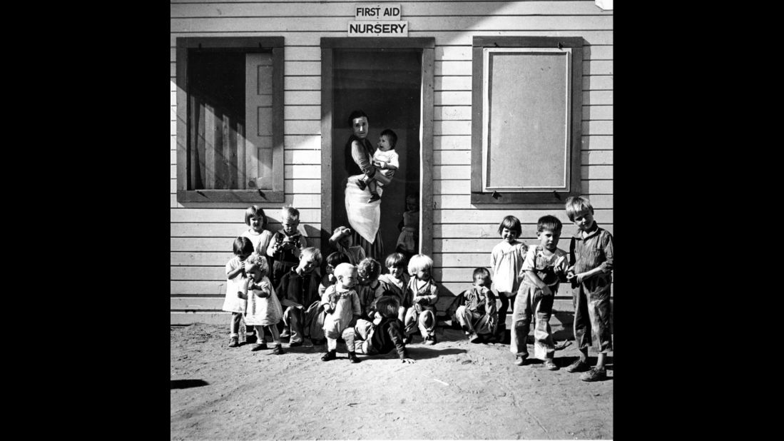 A nurse takes care of children of migratory farm workers in Arvin, California, in 1937. The unemployment rate hovered in the teens. FDR created large-scale public work programs to provide jobs for the poor and middle class.      