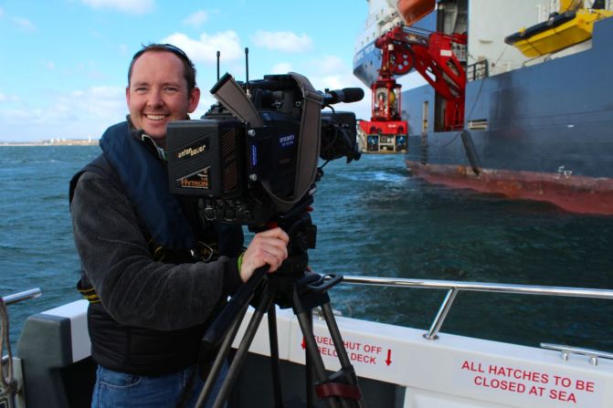 A CNN crew boarded a support vessel in the North Sea for a demonstration of remotely operated vehicles. Producer James Frater, pictured, describes the thrill of dragging heavy gear around a huge vessel in heavy seas.