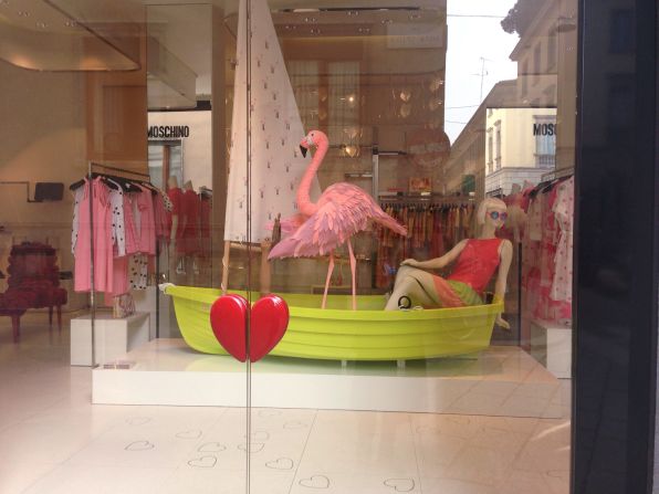 Boutiques can be works of art in themselves, set in historical buildings. Moschino's flamingo-themed decor takes window shopping to a more colorful level.