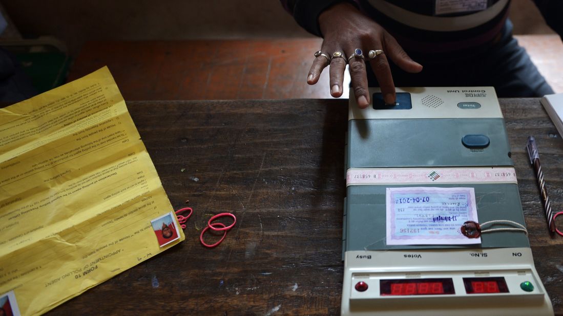 A polling official in Dibrugarh tests an electronic voting machine prior to the start of voting April 7.