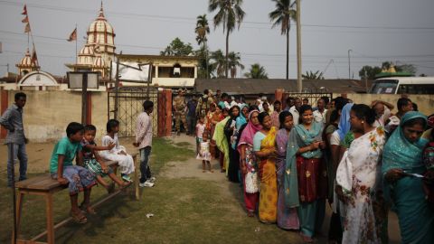 People wait in line to cast their votes during the first phase of voting in Dibrugarh.