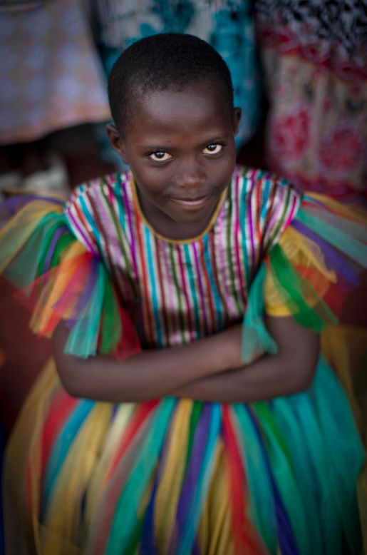 APRIL 7 - KIGALI, RWANDA: A young Rwandan girl sits amongst hundreds of people gathered at a ceremony to mark the arrival of the flame of remembrance, a symbolic fire traveling the country, and to hear memories of the<a href="http://edition.cnn.com/2014/04/04/world/africa/rwanda-remembering-forgetting-genocide/index.html?hpt=iaf_t2"> 20th anniversary of the genocide</a>.