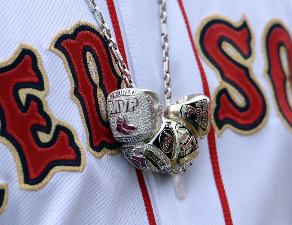 A necklace worn around David Ortiz's neck shows his three World Series rings and the ring he received for being named Most Valuable Player of the 2013 World Series. The Boston Red Sox slugger wore the necklace before his team's home opener Friday, April 4.