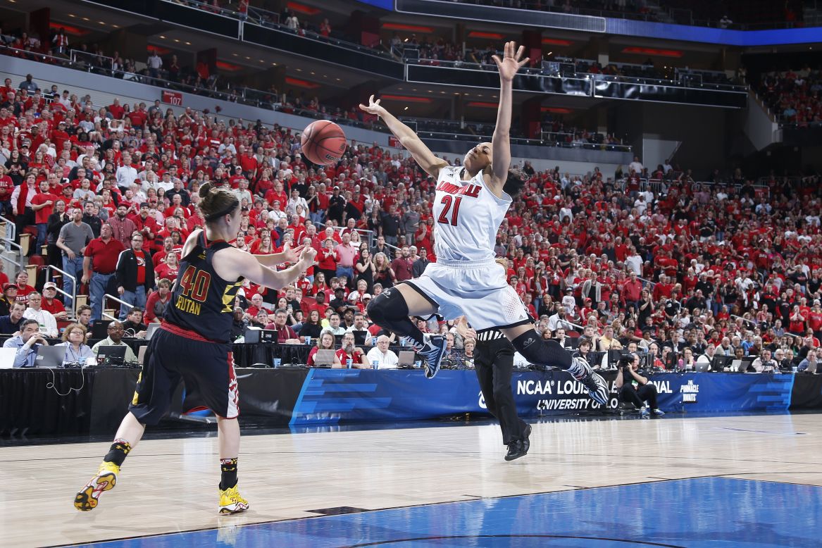 Maryland's Katie Rutan knocks the ball away from Louisville's Bria Smith during their NCAA Tournament game Tuesday, April 1, in Louisville, Kentucky.