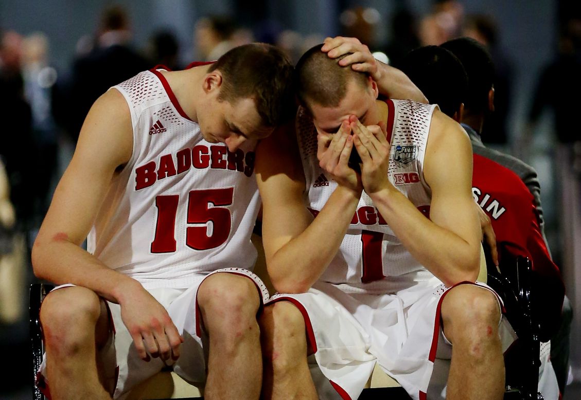 Wisconsin basketball players Sam Dekker, left, and Ben Brust react after losing to Kentucky in the Final Four of the NCAA Tournament on Saturday, April 5.