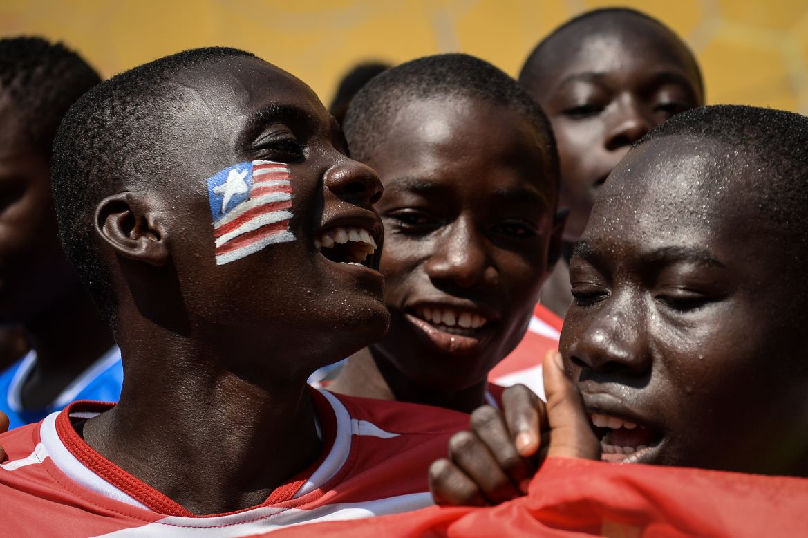 Liberian soccer players sing Tuesday, April 1, during the Street Child World Cup in Rio de Janeiro.