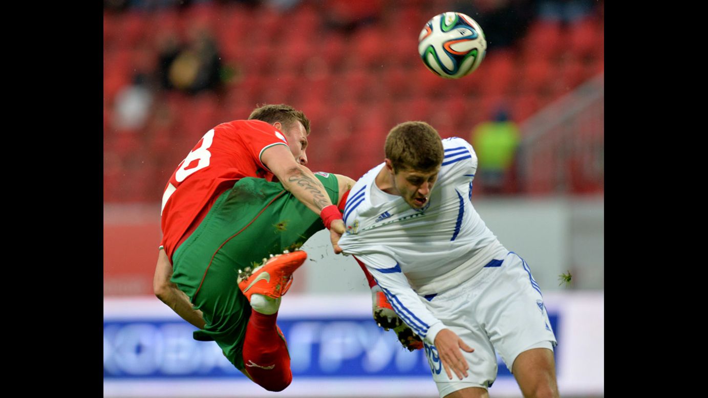 Jan Durica of Lokomotiv Moscow, left, is challenged by Artyom Danilenko of Volga Nizhny Novgorod during a Russian Premier League match Monday, April 7, in Moscow.