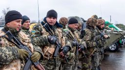 A unit of Ukrainian border guards line up before starting their patrol on the Russian border, in the village of Veseloye, in the Kharkiv region, on April 4, 2014.
