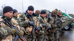 A unit of Ukrainian border guards line up before starting their patrol on the Russian border, in the village of Veseloye, in the Kharkiv region, on April 4, 2014.