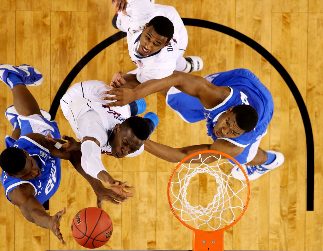 Kentucky Wildcat Alex Poythress goes up for a basket against Amida Brimah of the Connecticut Huskies during the NCAA Men's Championship on April 7, 2014.