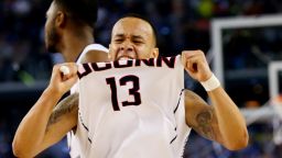 ARLINGTON, TX - APRIL 07:  Shabazz Napier #13 of the Connecticut Huskies celebrates on the court after defeating the Kentucky Wildcats 60-54 in the NCAA Men's Final Four Championship at AT&T Stadium on April 7, 2014 in Arlington, Texas.  (Photo by Ronald Martinez/Getty Images)