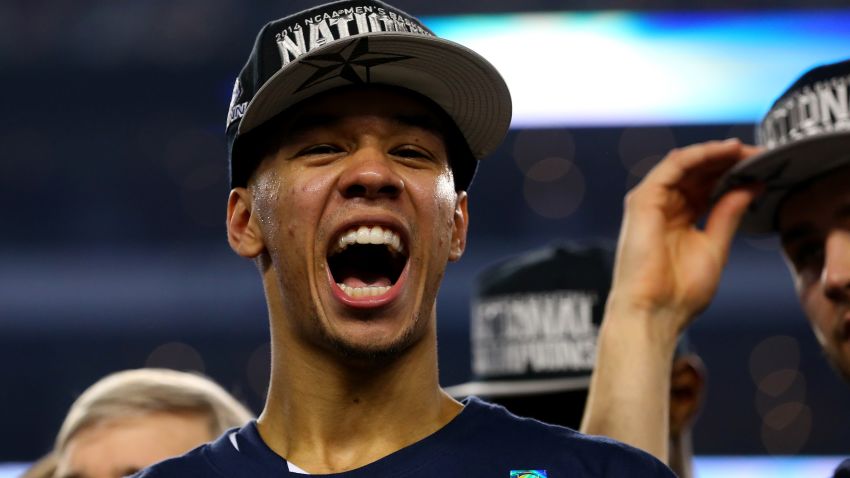 ARLINGTON, TX - APRIL 07: Shabazz Napier #13 of the Connecticut Huskies celebrates on the court after defeating the Kentucky Wildcats 60-54 in the NCAA Men's Final Four Championship at AT&T Stadium on April 7, 2014 in Arlington, Texas.  (Photo by Ronald Martinez/Getty Images)