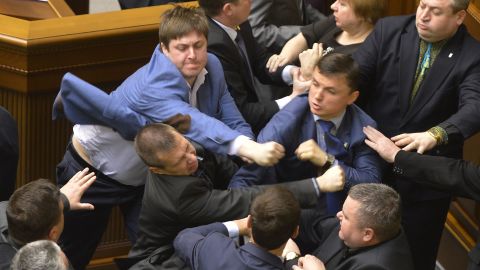 Ukrainian lawmakers from different parties scuffle during a Parliament session in Kiev on Tuesday, April 8.