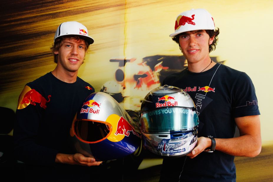 Origone's younger brother Ivan (r) posing alongside Red Bull Formula One world champion Sebastian Vettel in 2009. The 27-year-old is sponsored by the Austrian energy drink brand and is one of the world's finest speed skiers, setting a junior record of 250.7 km/h (155.7 mph) in 2006.