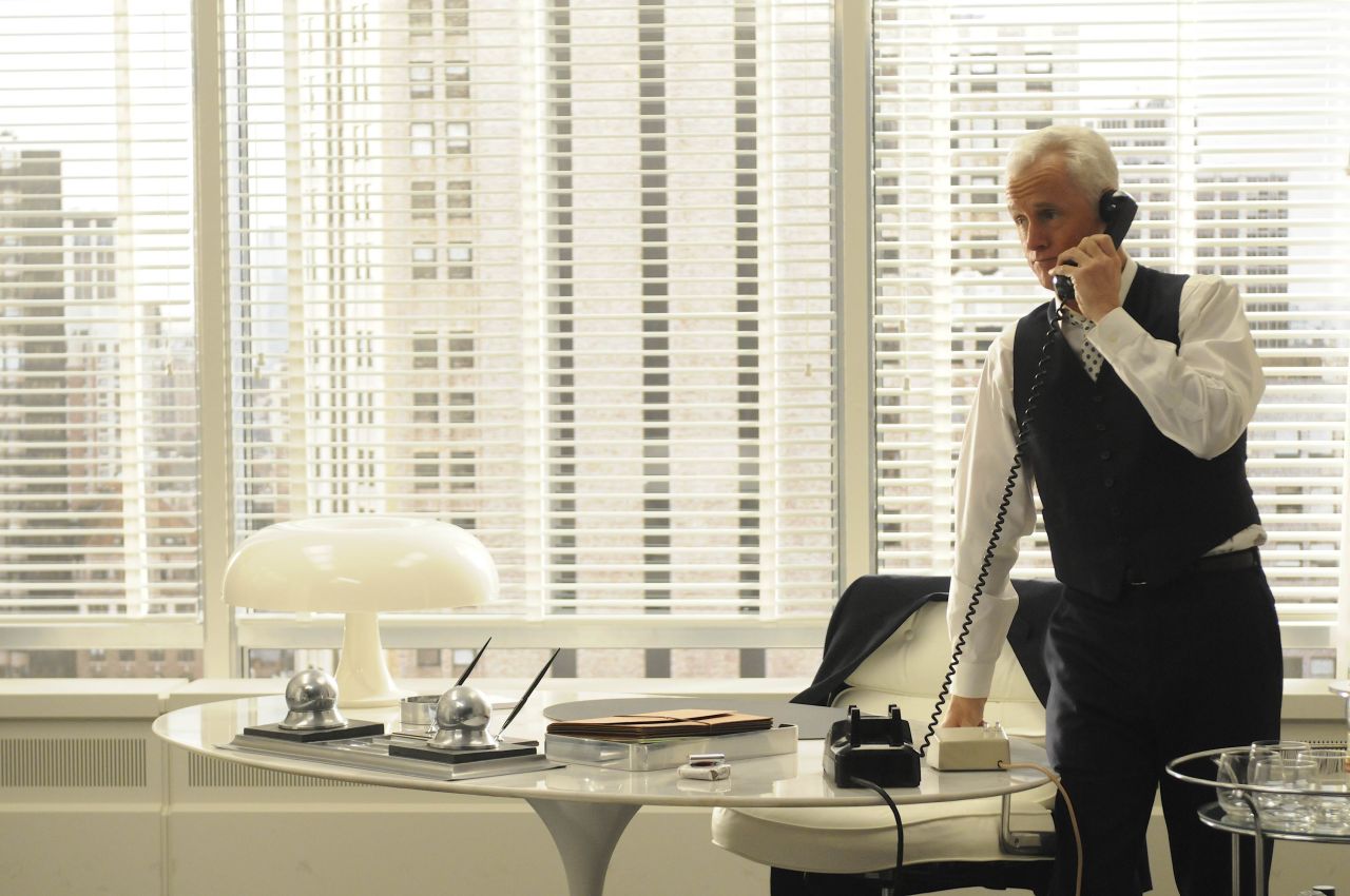 Roger Sterling's three-piece suit in the fourth season represents the division of public and private at the office, Przybyszewski said. Even in 1964, a businessman would keep his jacket on to meet clients and take it off only in the privacy of his office.