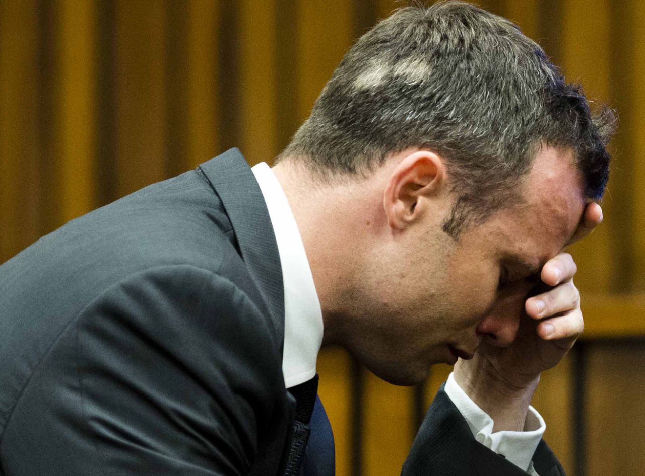 Pistorius puts his hand to his face while listening to cross-questioning on March 7.