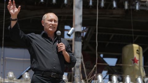 Russian Prime Minister Vladimir Putin addresses the audience as he meets with Russian and Ukrainian motorbikers near Sevastopol in the Crimea Peninsula on July 24, 2010