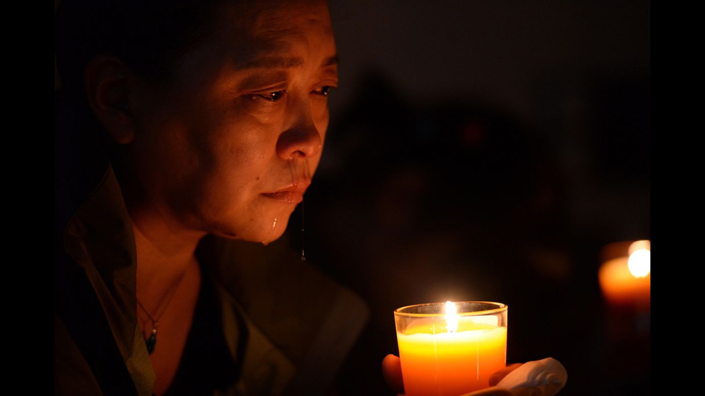 A relative of a missing passenger cries at a vigil in Beijing on April 8, 2014.