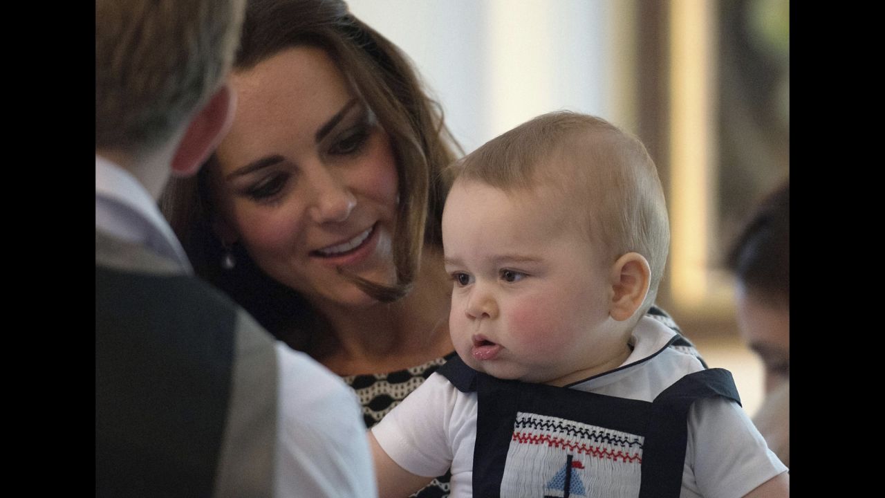 Catherine holds Prince George at a specially convened play group at Government House in Wellington on Wednesday, April 9.