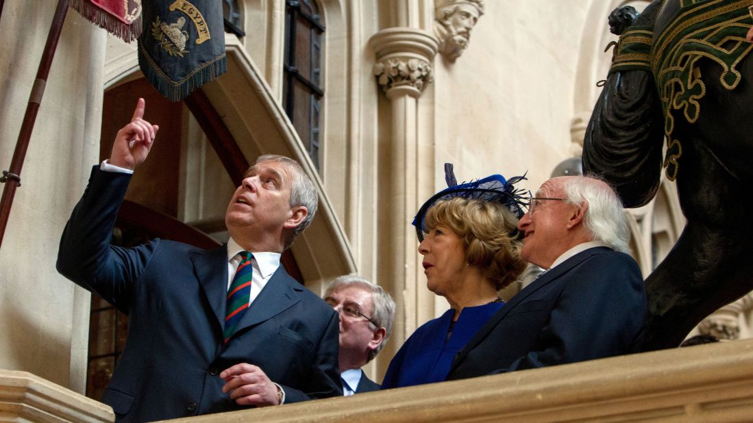 Prince Andrew, Duke of York, shows Higgins and his wife, Sabina, the Colors of the Disbanded Irish Regiments at Windsor Castle on April 9.