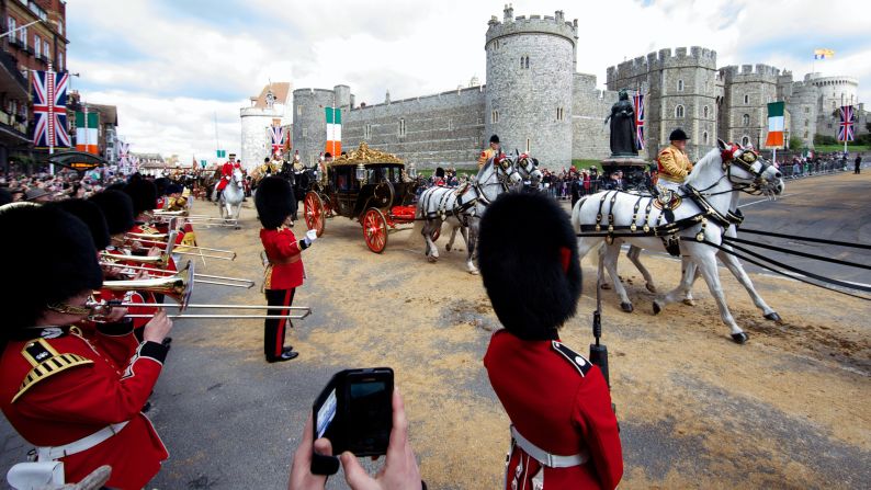 Higgins and Queen Elizabeth travel by state carriage toward Windsor Castle on April 8.