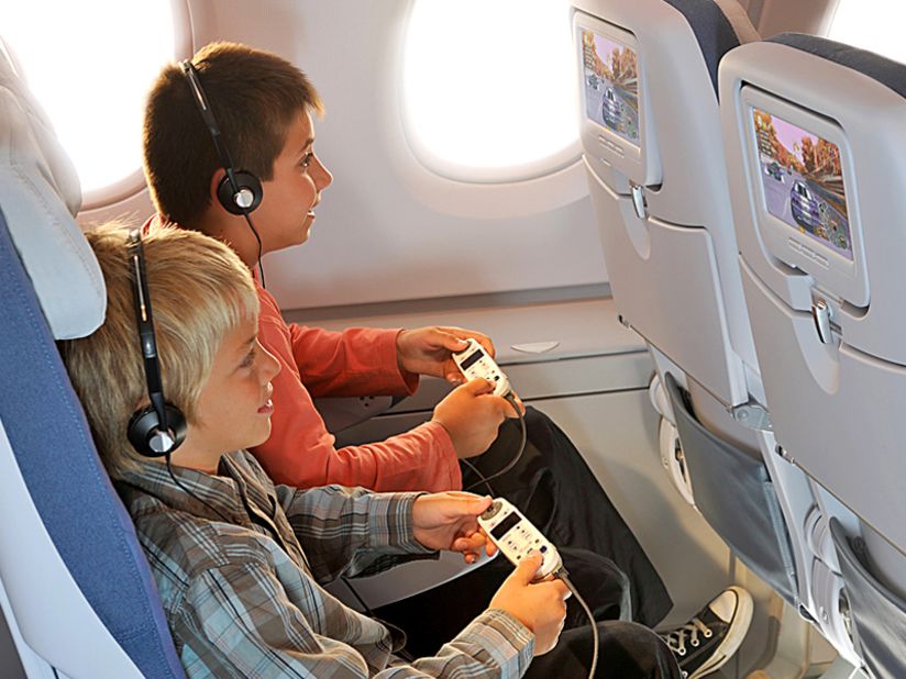 The in-flight entertainment system is your best friend on a flight. Hours of kids' movies, games and TV shows to keep them busy. Pack an extra pair of headphones though. Some airlines only hand out ear bud sets, which aren't built for little heads.  