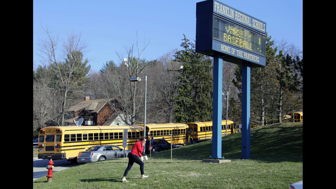 A woman walks onto the campus of the Franklin Regional School District on April 9.