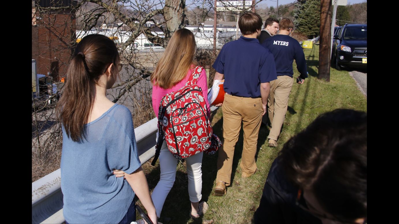 Students walk away from the campus on April 9.