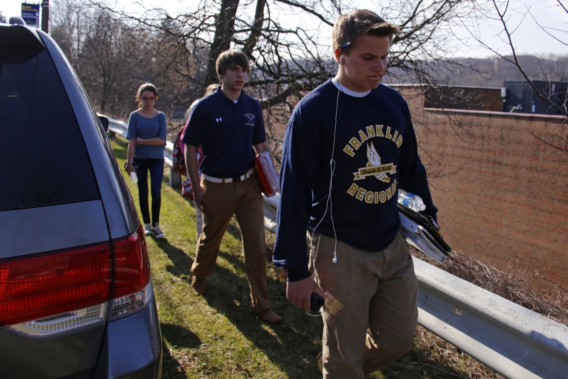 Students leave the school's campus on April 9.